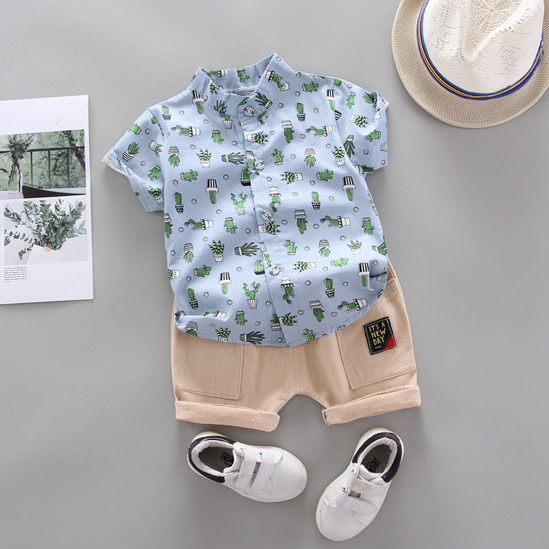 Light blue printed boy shirt featuring a cactus design, paired with beige shorts and white shoes.