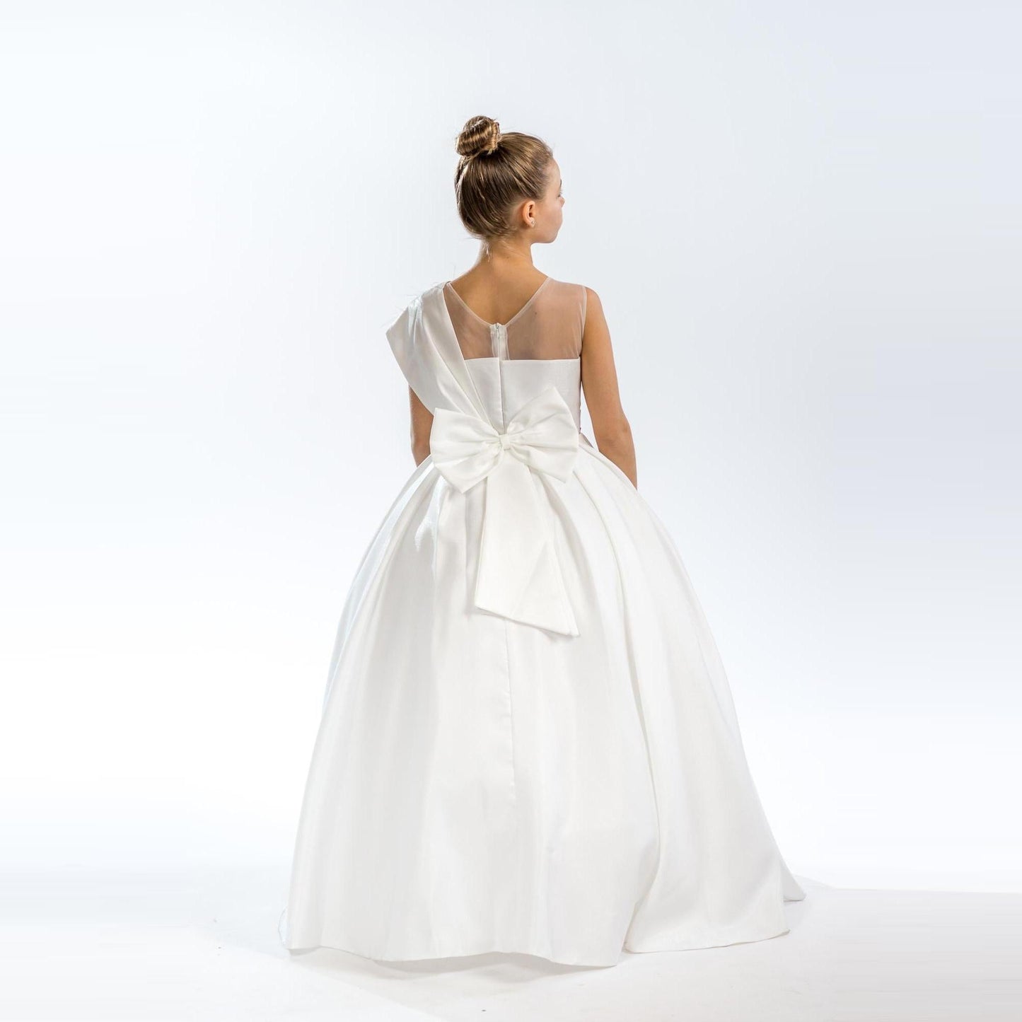 Noble Beauty Girls Formal Dress in white, featuring a large bow at the back and a full skirt design.