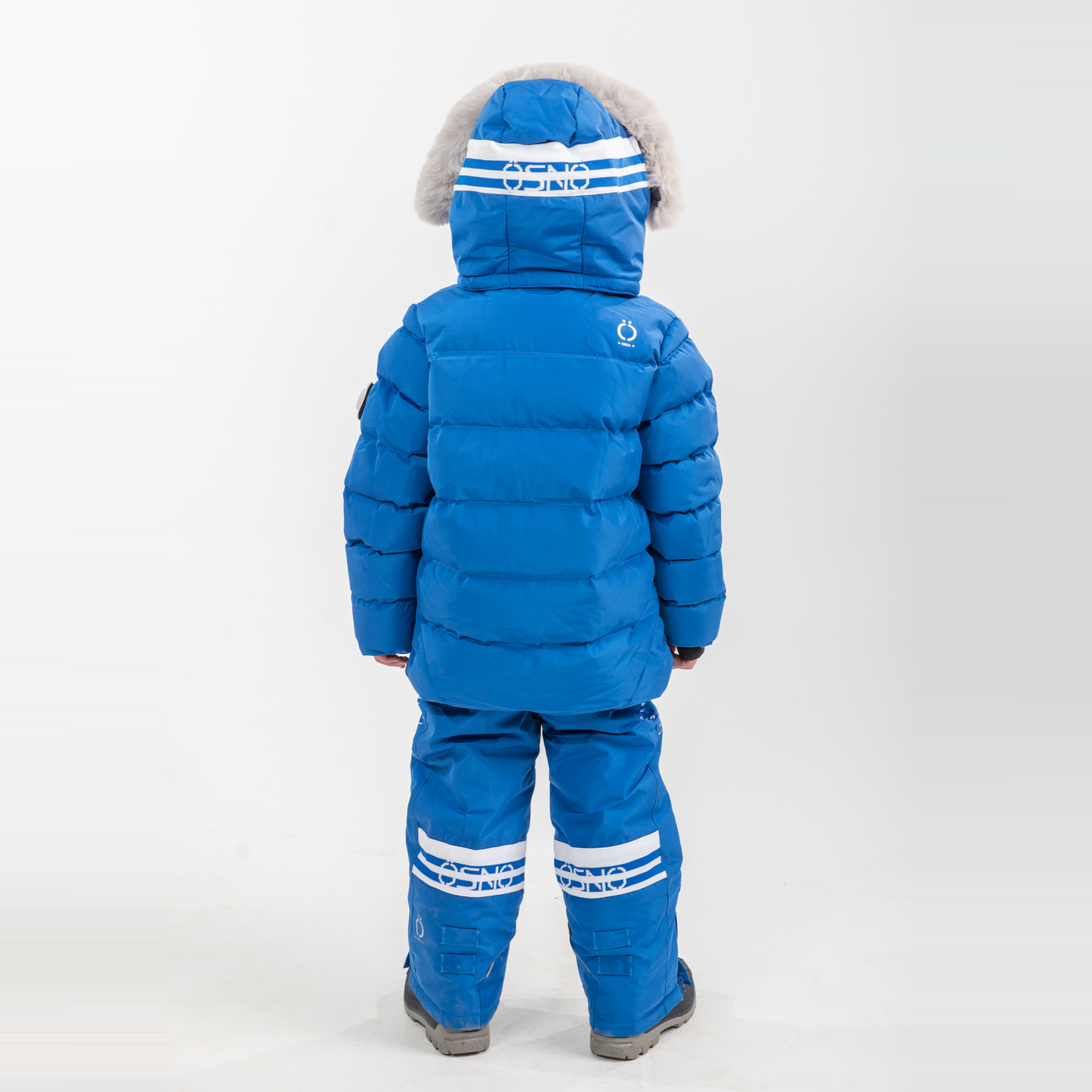Liam's Luxury Snowsuit features a blue puffy jacket with a fur-lined hood and matching snowpants, designed for warmth and sty