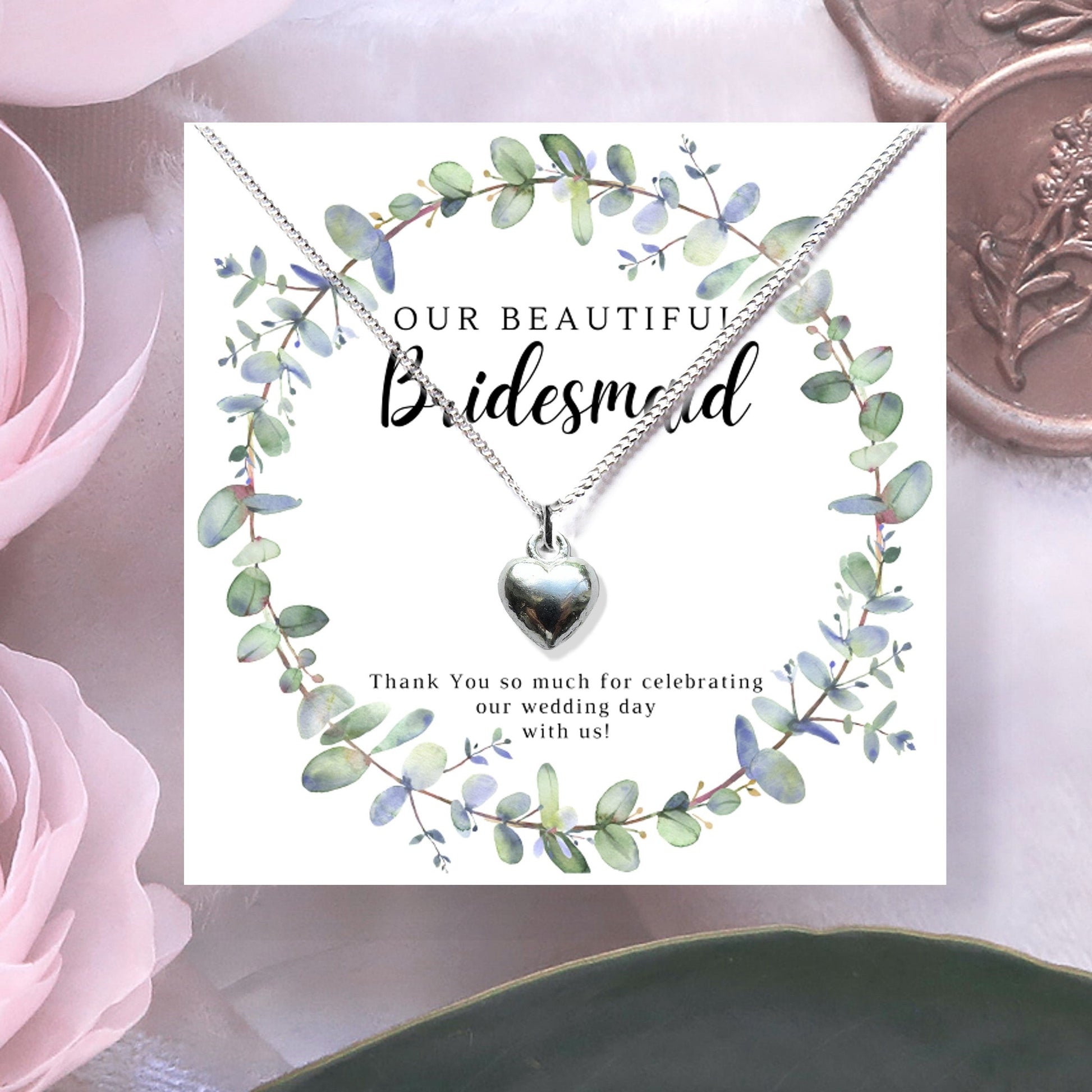 Bridesmaids Heart Necklace with a silver heart pendant on a chain, presented with a eucalyptus-themed thank you card.