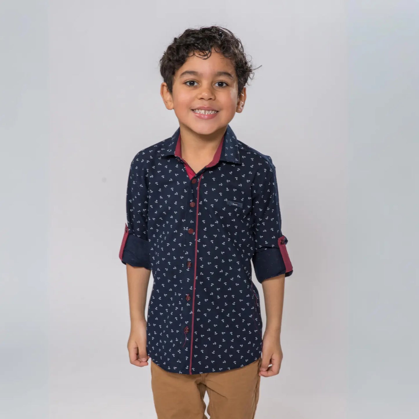 Anchor Boys Cotton Shirt featuring a navy blue base with a white pattern, rolled sleeves, and contrasting red accents.