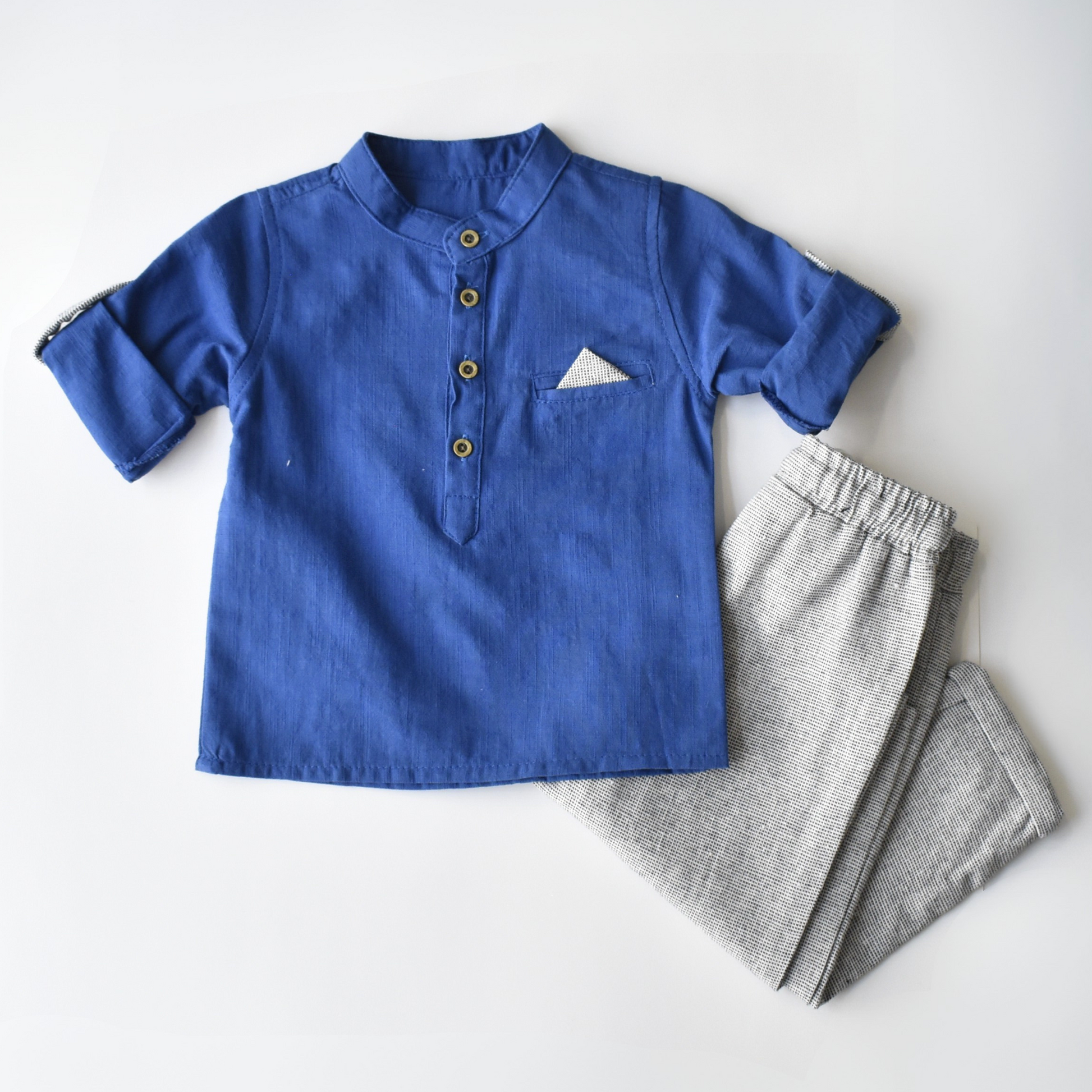 Breezy Ben Boys Casual Set featuring a blue short-sleeve shirt with buttons and a pocket, paired with gray pants.