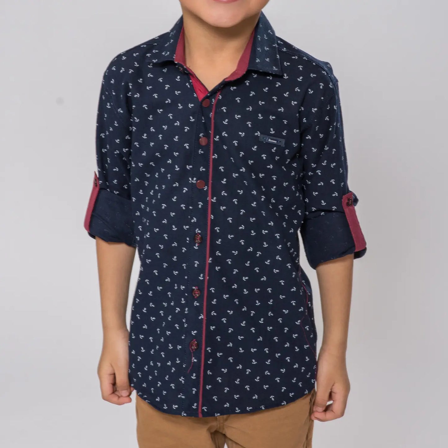 Anchor Boys Cotton Shirt featuring a navy blue fabric with white anchor patterns, red accents, and rolled-up sleeves.