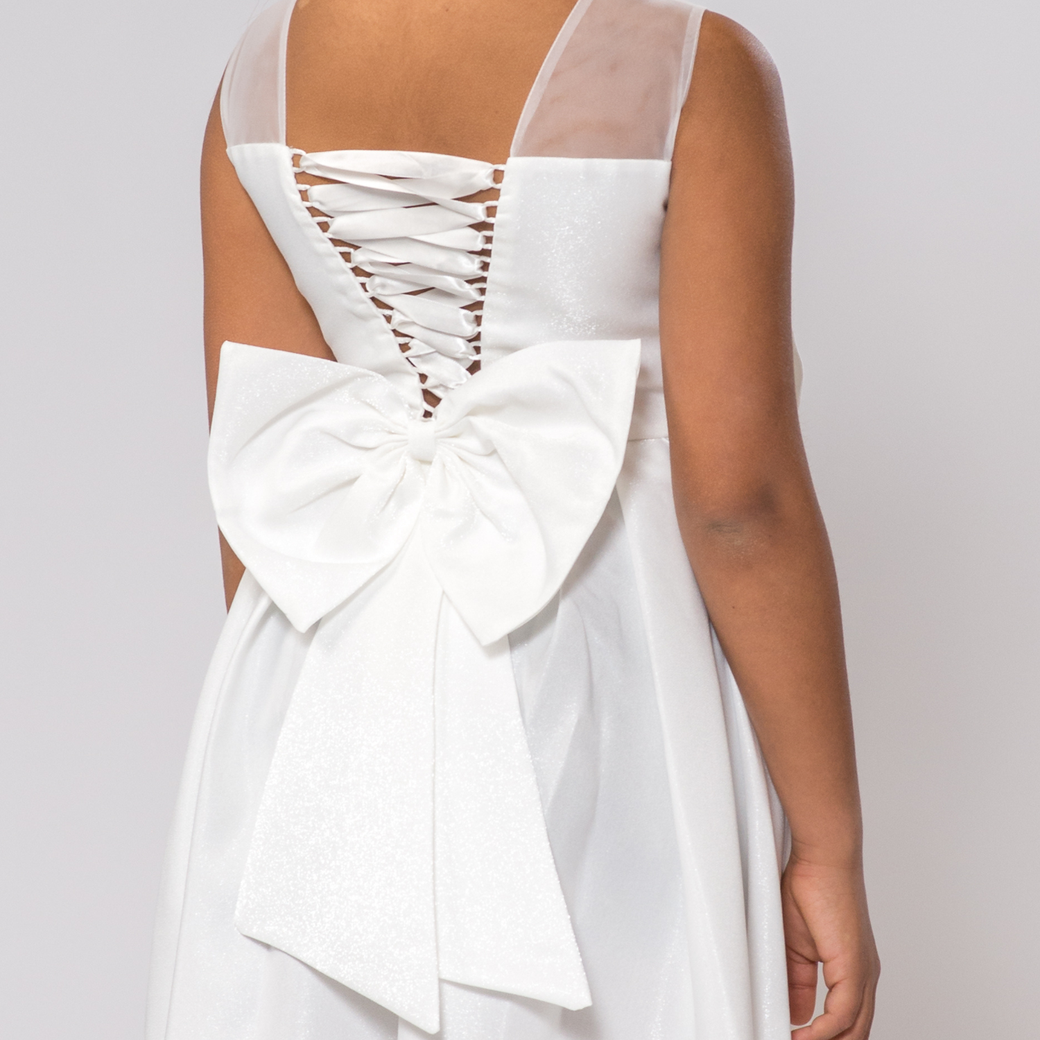 Back view of the Splendid Charm A-Line Dress featuring a lace-up design and a large white bow at the waist.