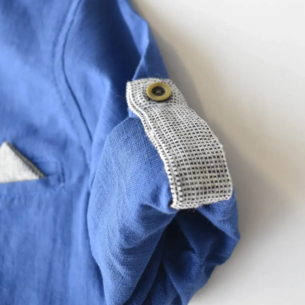 Breezy Ben Boys Casual Set featuring a blue shirt with a textured gray cuff and button detail.
