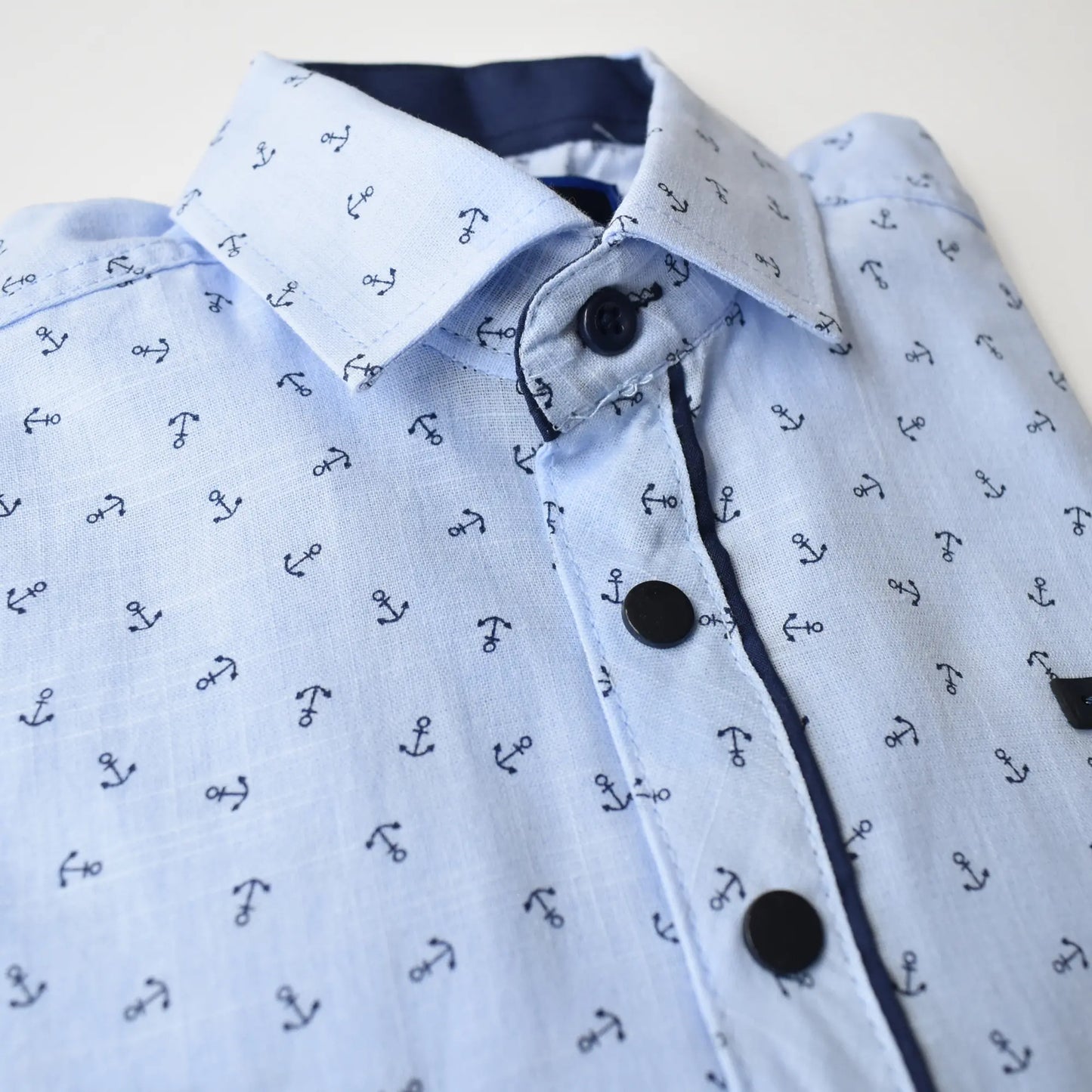 Light blue Anchor Boys Cotton Shirt featuring a nautical anchor print, button closure, and contrasting collar.