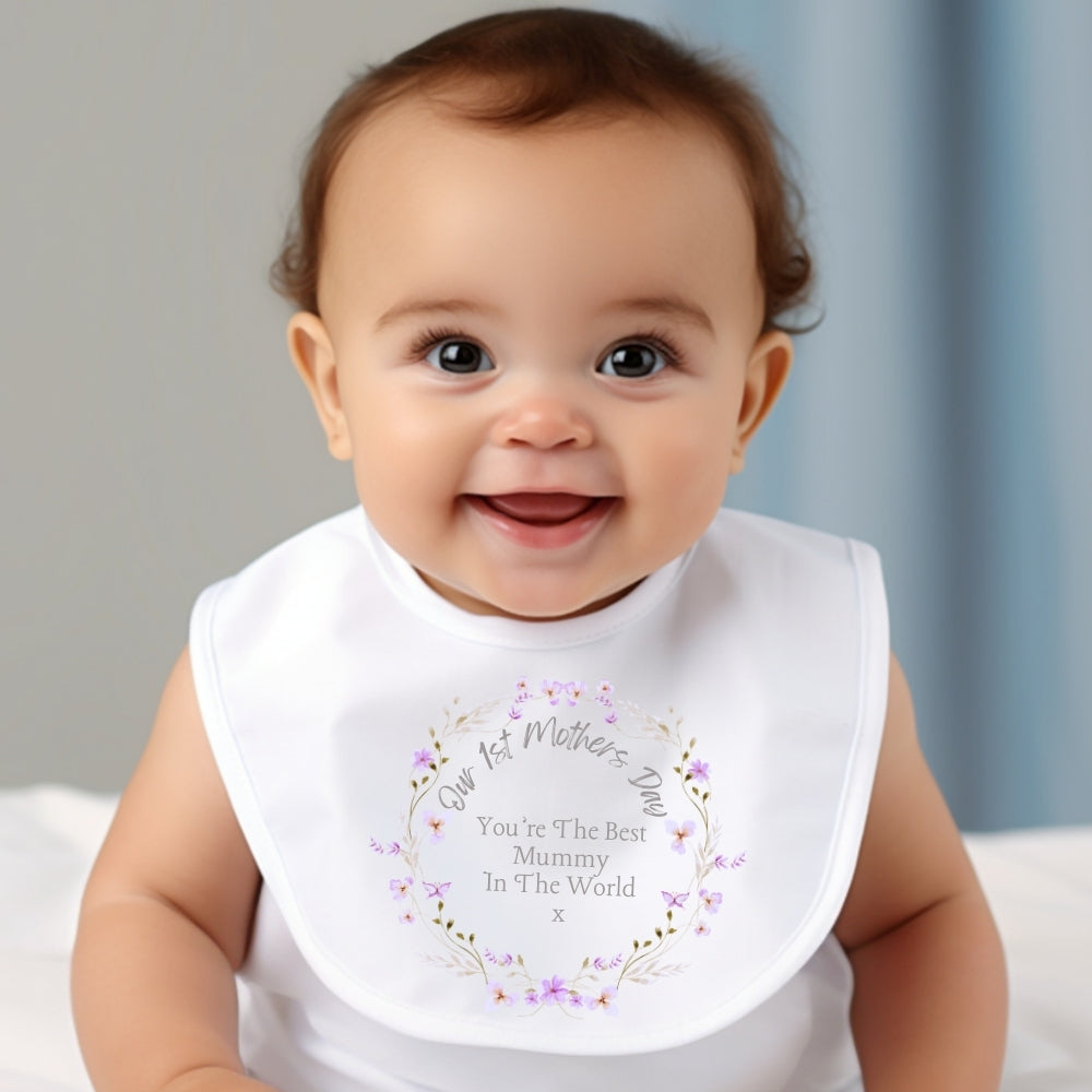 Baby outfit for Mother's Day featuring a bib with floral design and text, smiling baby wearing the outfit.