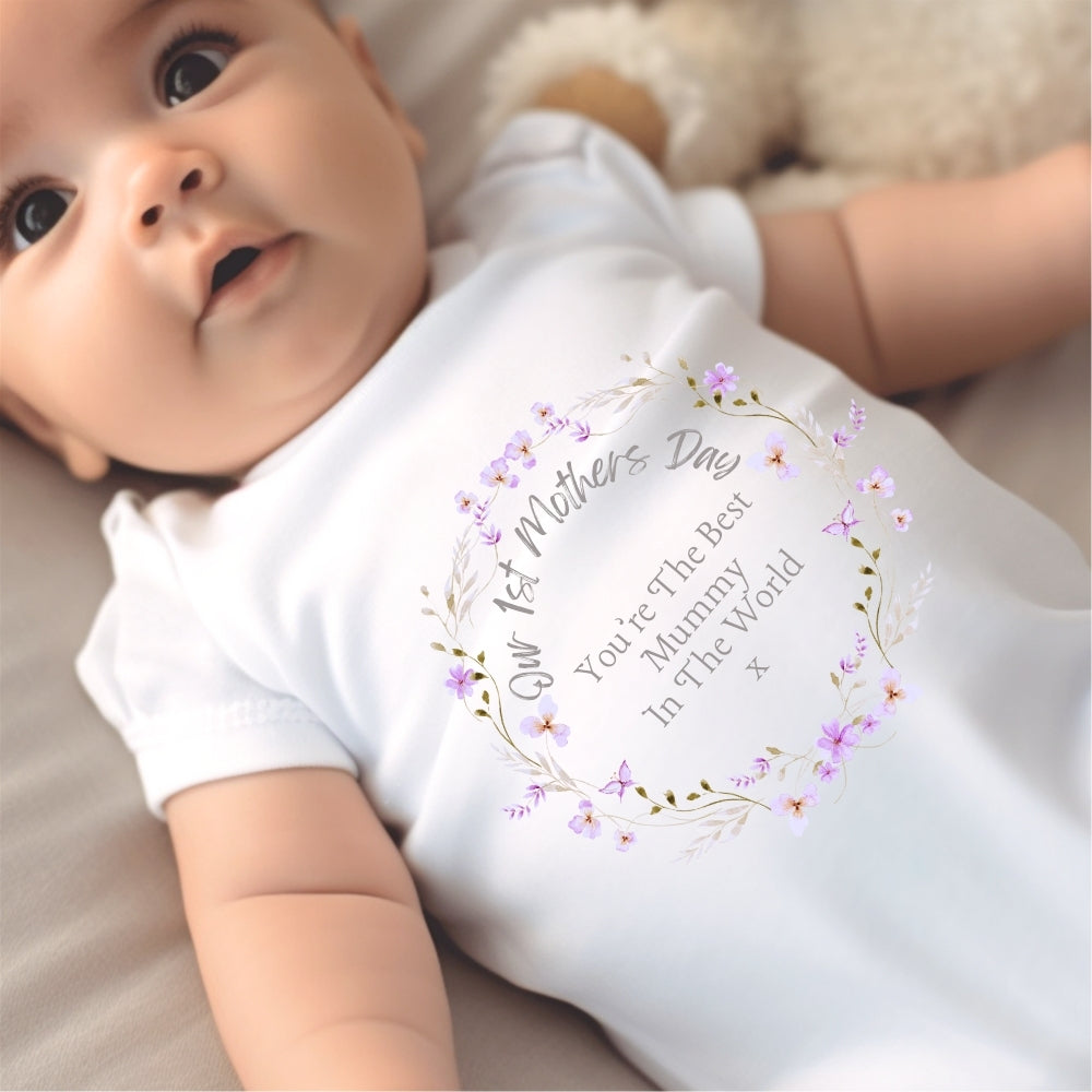 1st Mother's Day Pretty Flowers Baby Outfit featuring a white baby grow with floral design and text: "You're The Best Mummy I