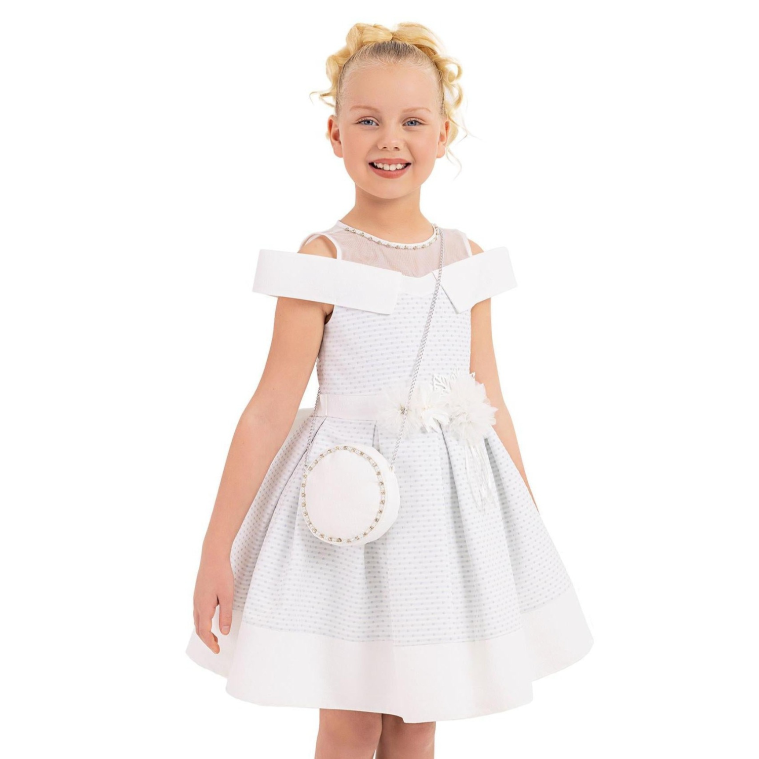 Dear Amy Girls Formal Dress features a white dress with off-shoulder straps, a flared skirt, and a decorative flower.