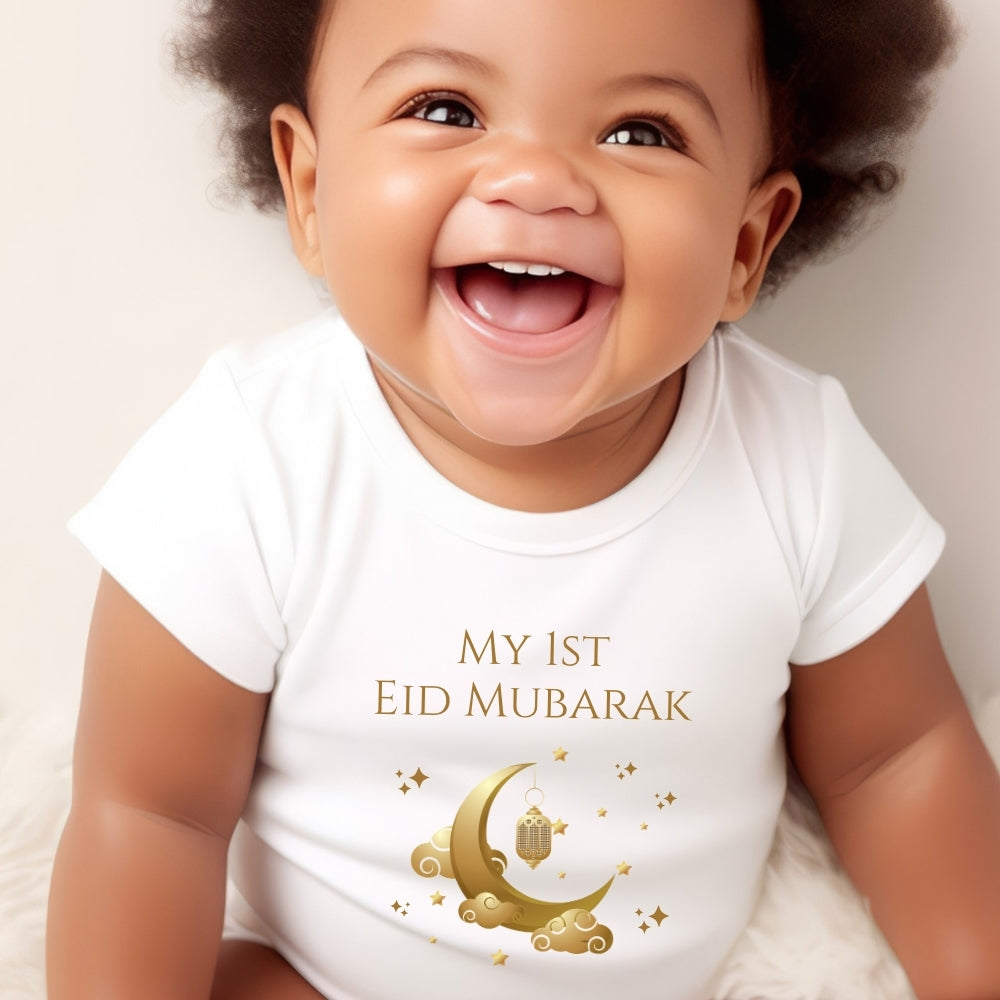 Personalised 1st Eid Mubarak Gift Hamper featuring a smiling baby in a white vest with gold crescent moon and lantern design.