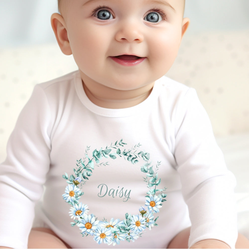 Personalised Daisy Flowers Baby Outfit featuring a white vest with a floral design and the name "Daisy."