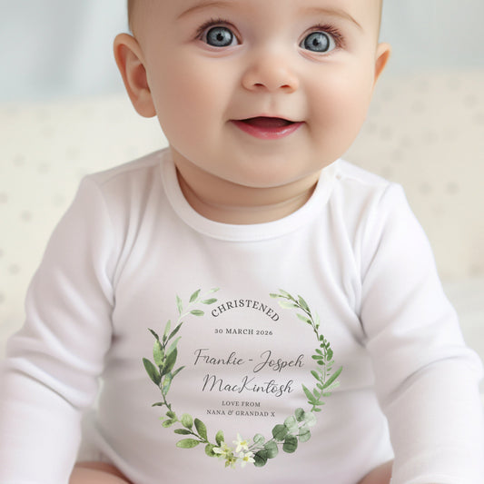 Personalised Christening Day Baby Outfit featuring a white vest with floral design and custom text for a baby.