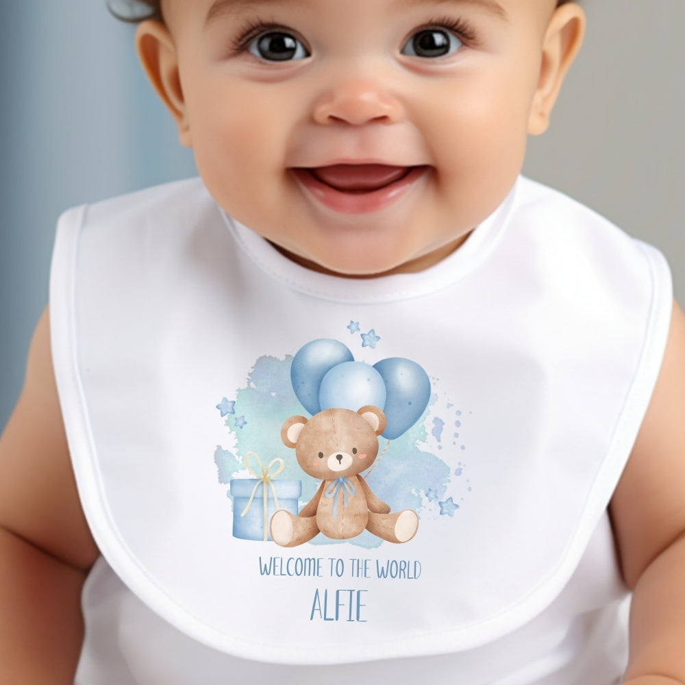 Personalised baby boy outfit featuring a bib with a teddy bear design and the name "Alfie" in blue and white colors.