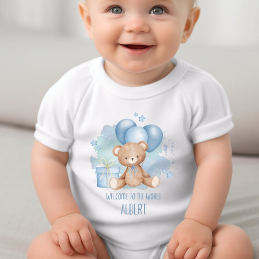 Personalised baby boy outfit featuring a white vest with a teddy bear design, blue balloons, and the name "ALBERT."
