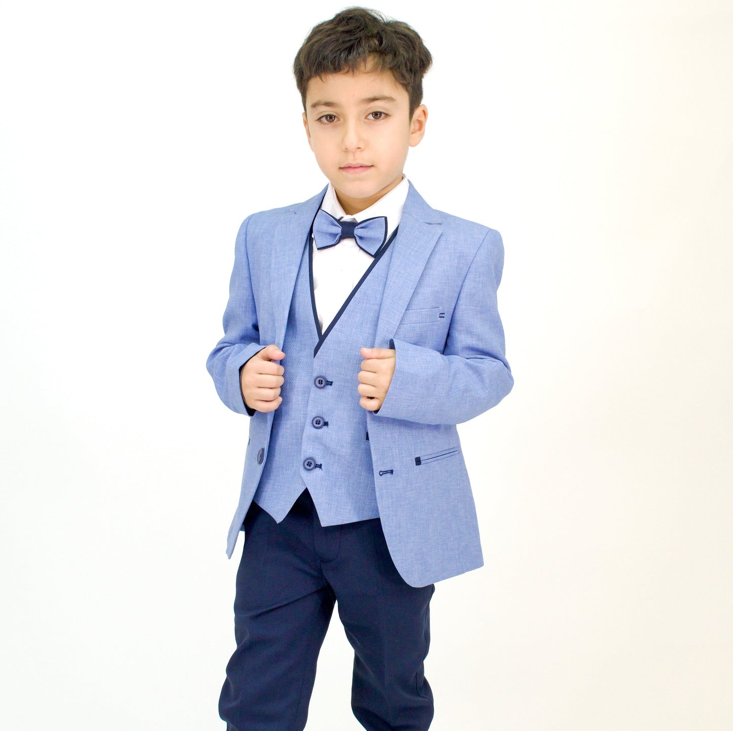 Captain Stylish Formal Boys Suit featuring a light blue blazer, matching vest, white shirt, and navy trousers, complemented b