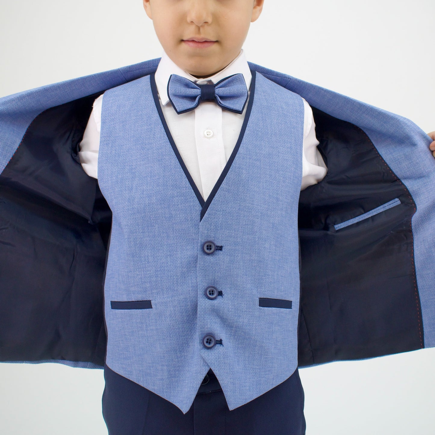 Captain Stylish Formal Boys Suit featuring a light blue vest with a bow tie, white shirt, and dark pants, displayed open.