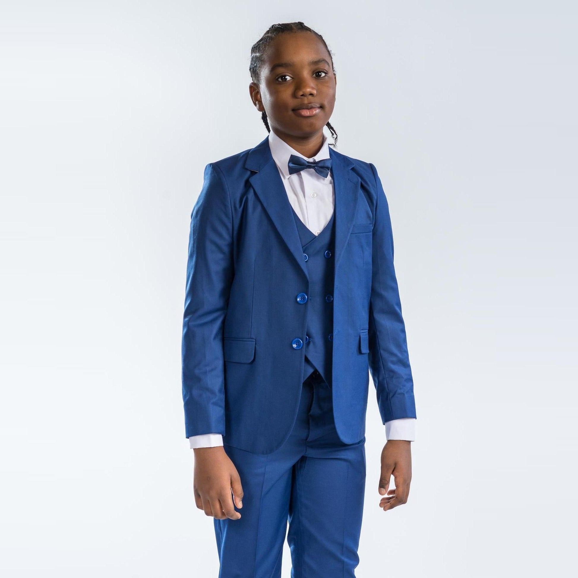Classic Groom Boys Suits in royal blue, featuring a blazer, vest, and bow tie, worn by a young boy.