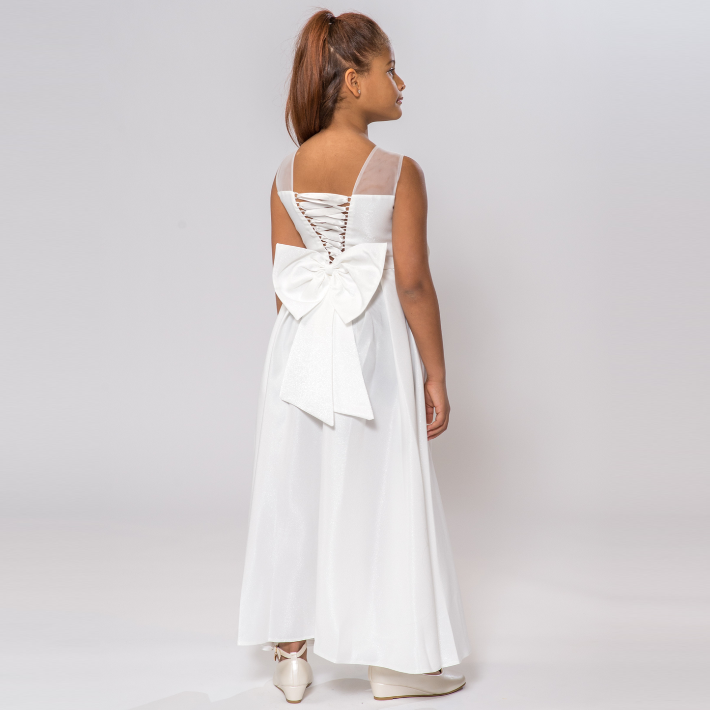 White Splendid Charm A-Line Dress featuring a lace-up back and a large bow at the waist, perfect for special occasions.