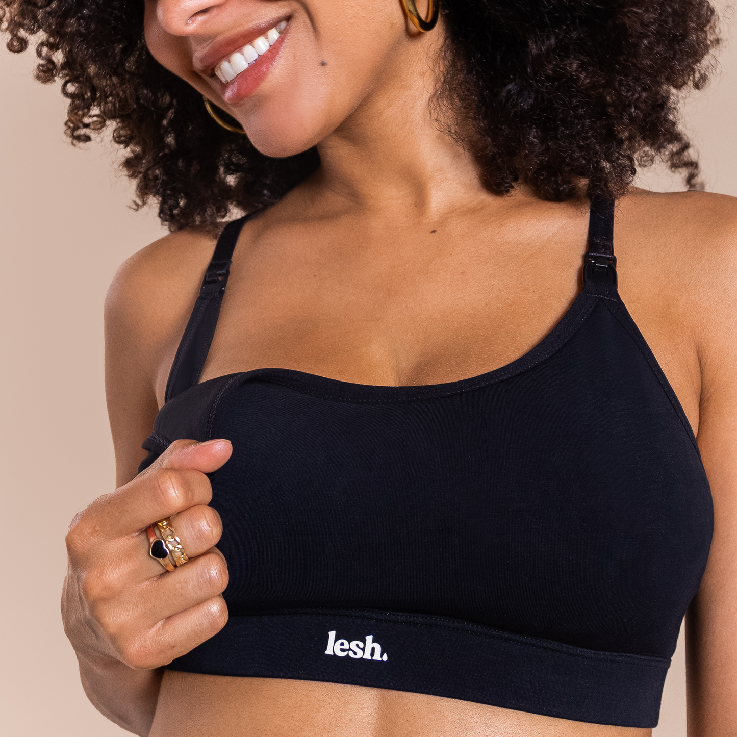 Black LESH FREEFLO 2.0 LEAKPROOF NURSING BRA worn by a woman, featuring adjustable straps and a comfortable design.