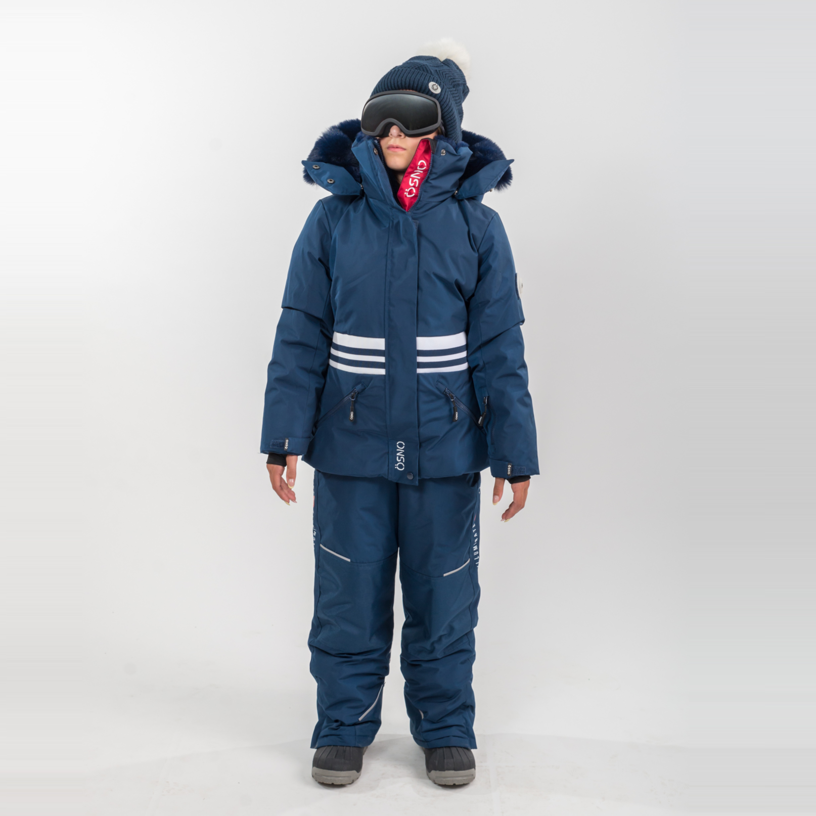 Karina's Luxury Snowsuit features a navy jacket with white stripes and matching snowpants, complete with a fur-lined hood and