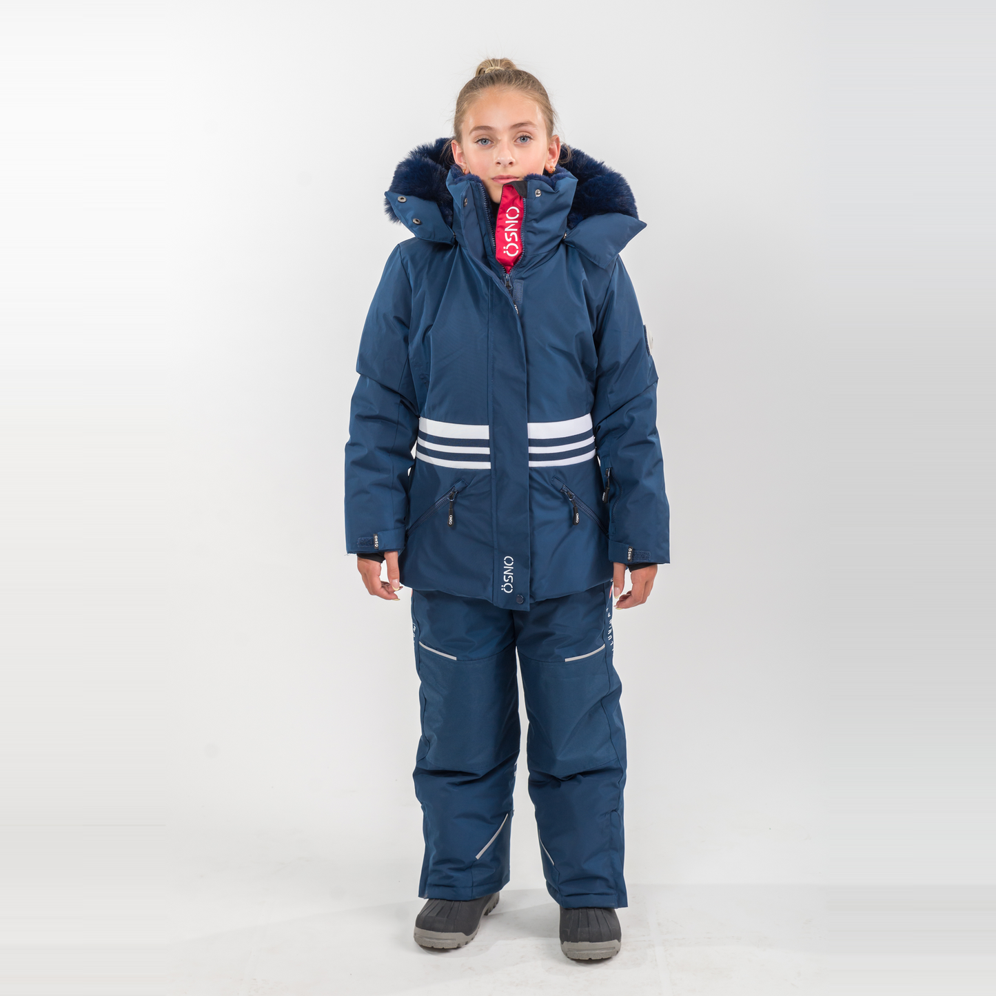 Karina's Luxury Snowsuit features a navy jacket with white stripes and matching snowpants, designed for winter wear.