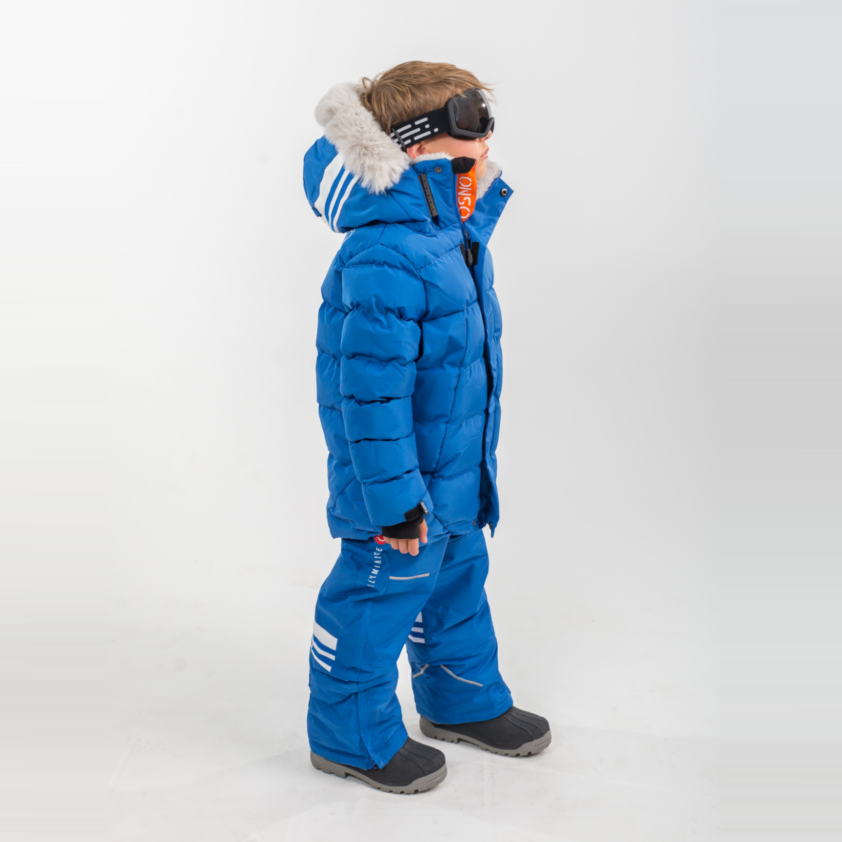 Liam's Luxury Snowsuit features a bright blue jacket with a fur-lined hood and matching snowpants, perfect for winter activit