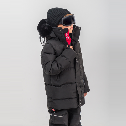 Rafa's Luxury Snowsuit features a black puffy jacket and snowpants, paired with a beanie and oversized goggles.