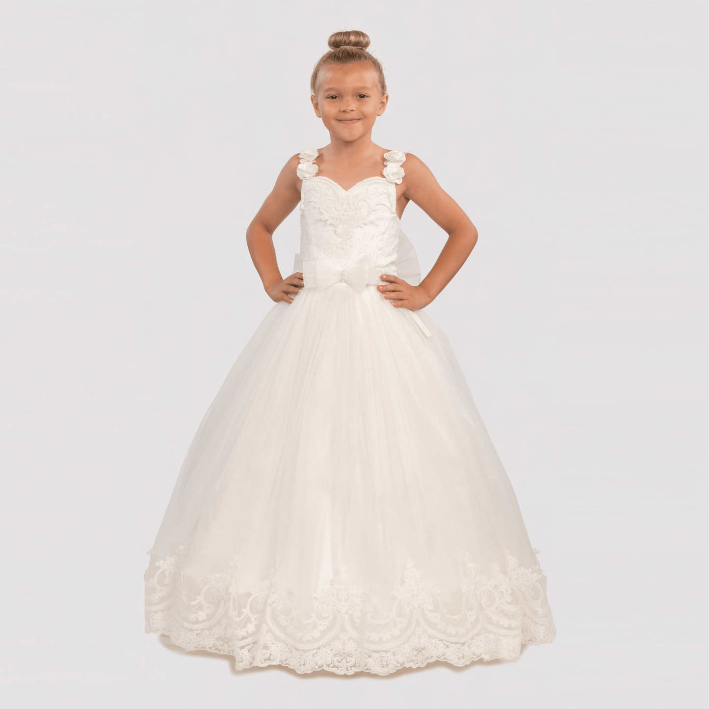 Bianca Princess Girls Formal Dress features a white, floor-length gown with floral straps and lace detailing.