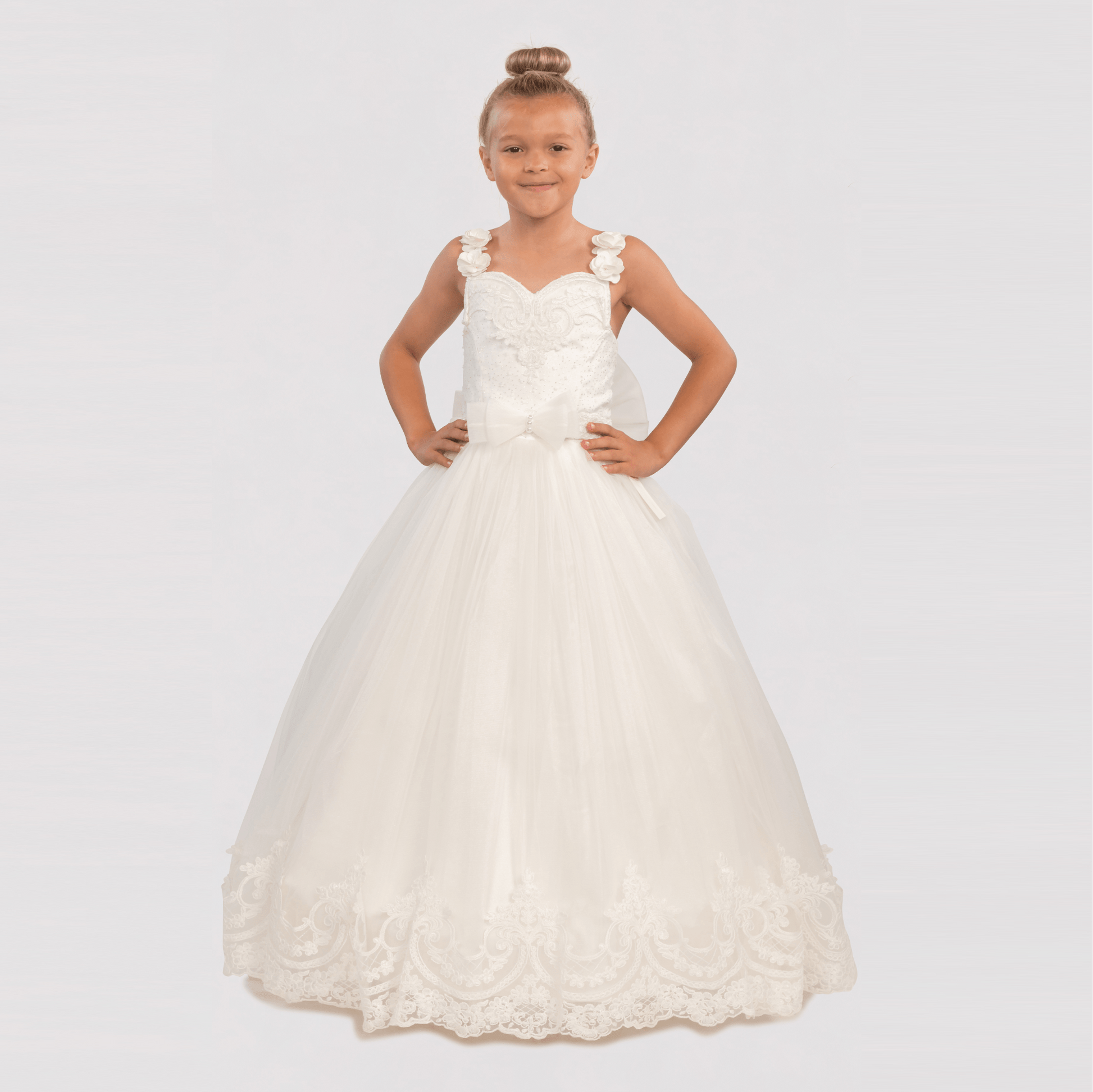 Bianca Princess Girls Formal Dress features a white, floor-length gown with floral straps and lace detailing.