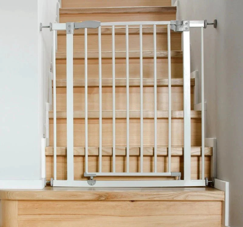 FYLO Baby Safety Stair Gate Pressure Fit Extra Wide, white metal gate installed at the top of wooden stairs.